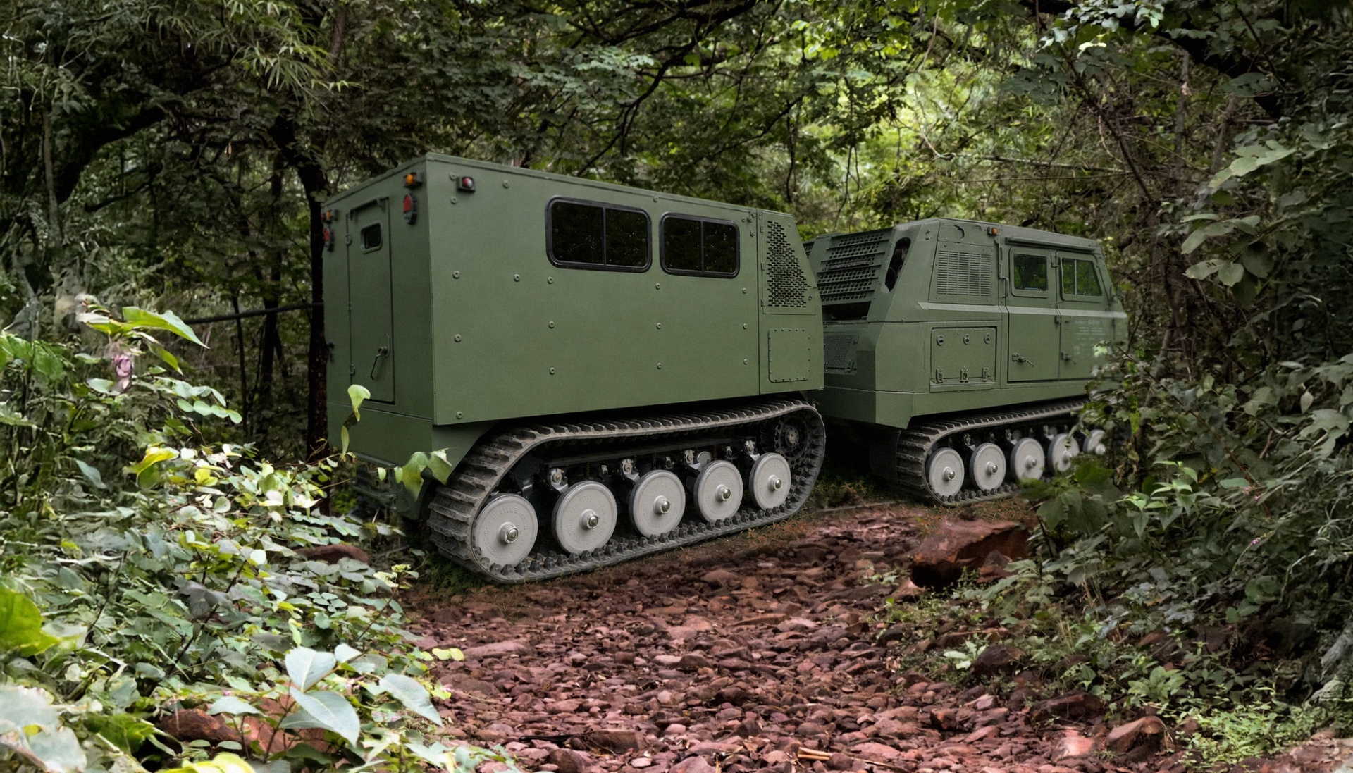 Voyager D12 articulated tracked carrier navigating a forest trail